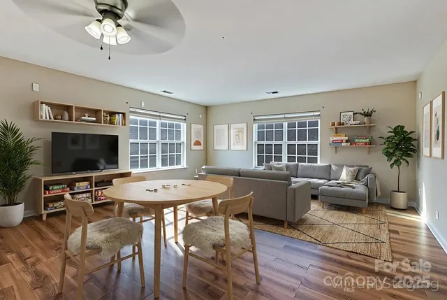 an aerial view of a house with garden space and street view
