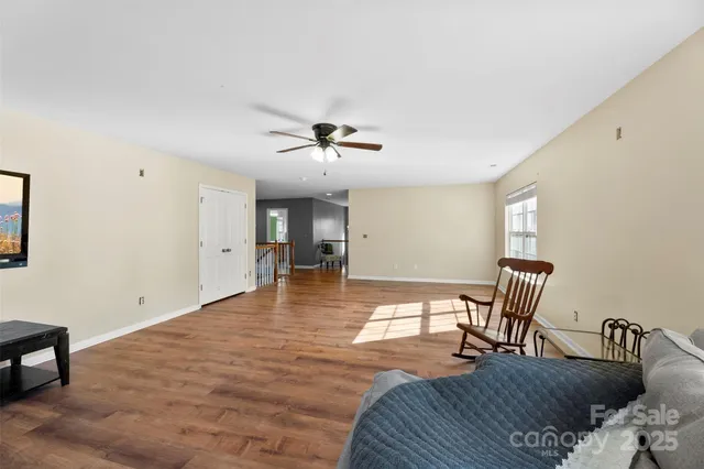 a view of a livingroom with furniture and wooden floor