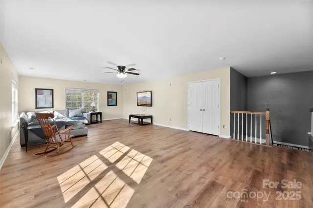 a living room with furniture window and wooden floor
