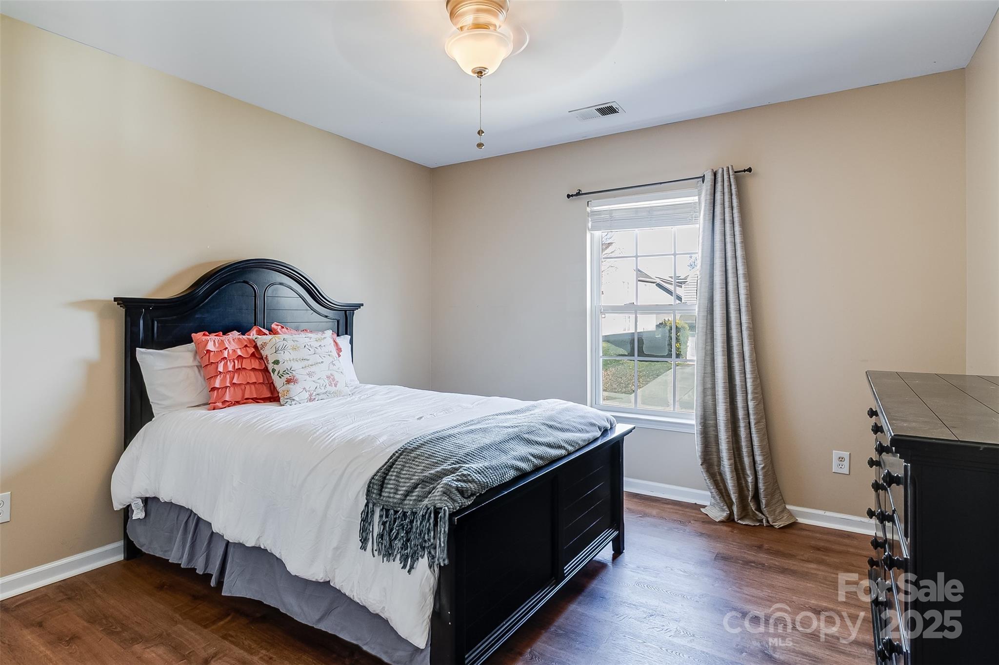 224 Morning Dew Lane Mount Holly, NC 28120 - Photo 26 of 48 a bedroom with a bed and wooden floor