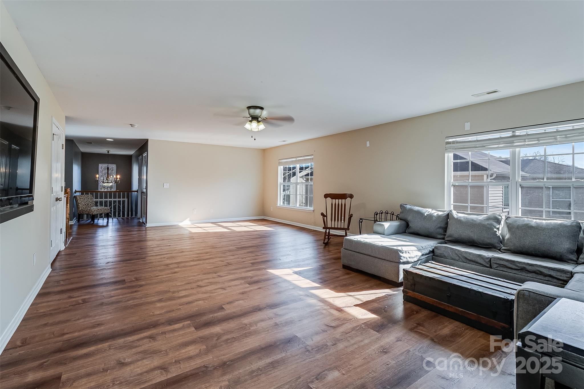 224 Morning Dew Lane Mount Holly, NC 28120 - Photo 32 of 48 a living room with furniture and wooden floor