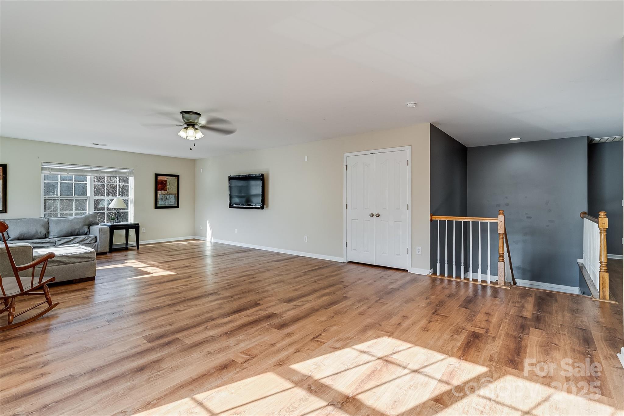 224 Morning Dew Lane Mount Holly, NC 28120 - Photo 33 of 48 a view of an empty room with wooden floor and a window