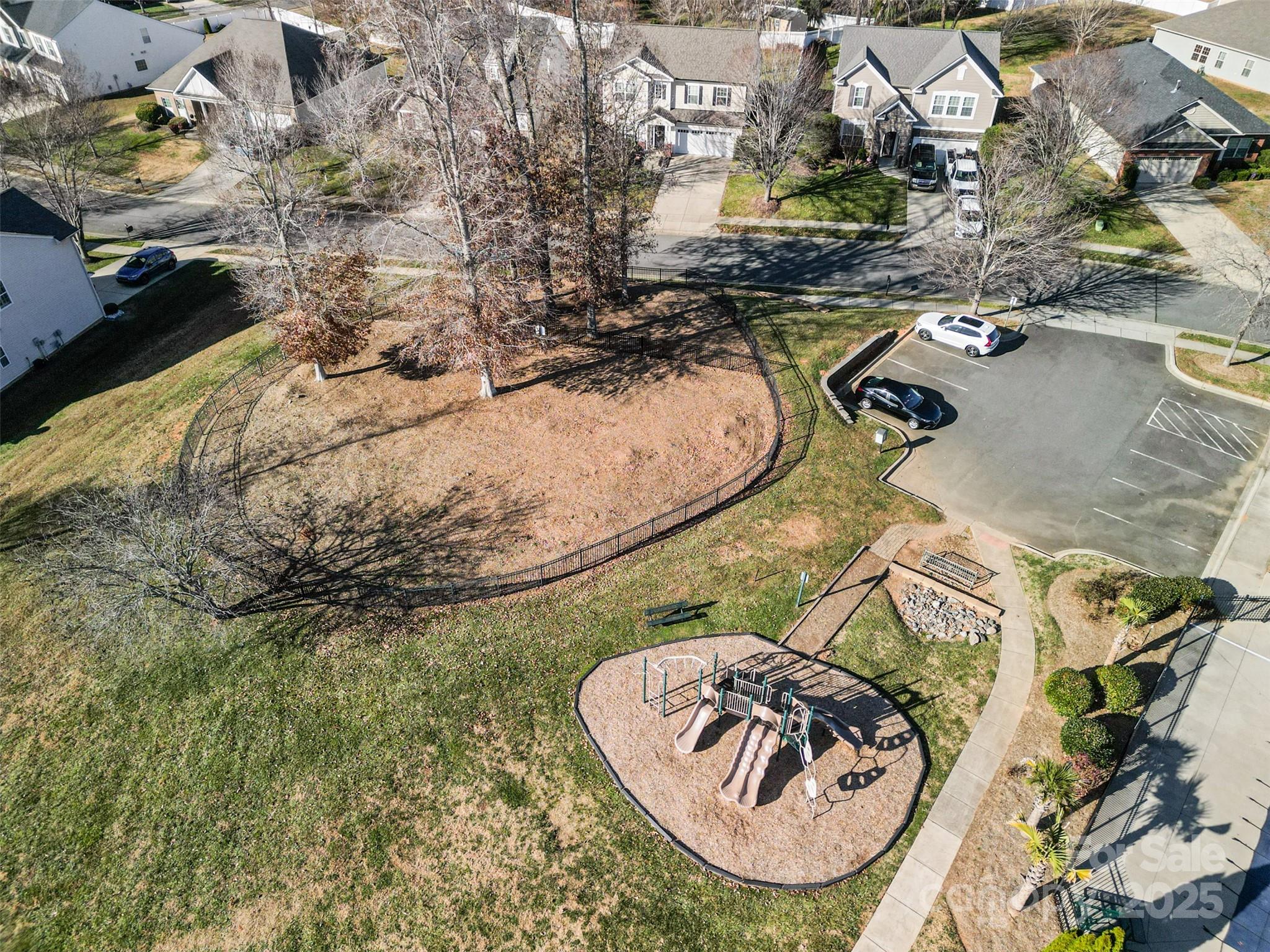 224 Morning Dew Lane Mount Holly, NC 28120 - Photo 40 of 48 an aerial view of a swimming pool with a yard and trees