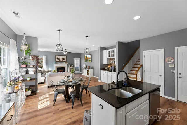 a kitchen with granite countertop a sink and stove