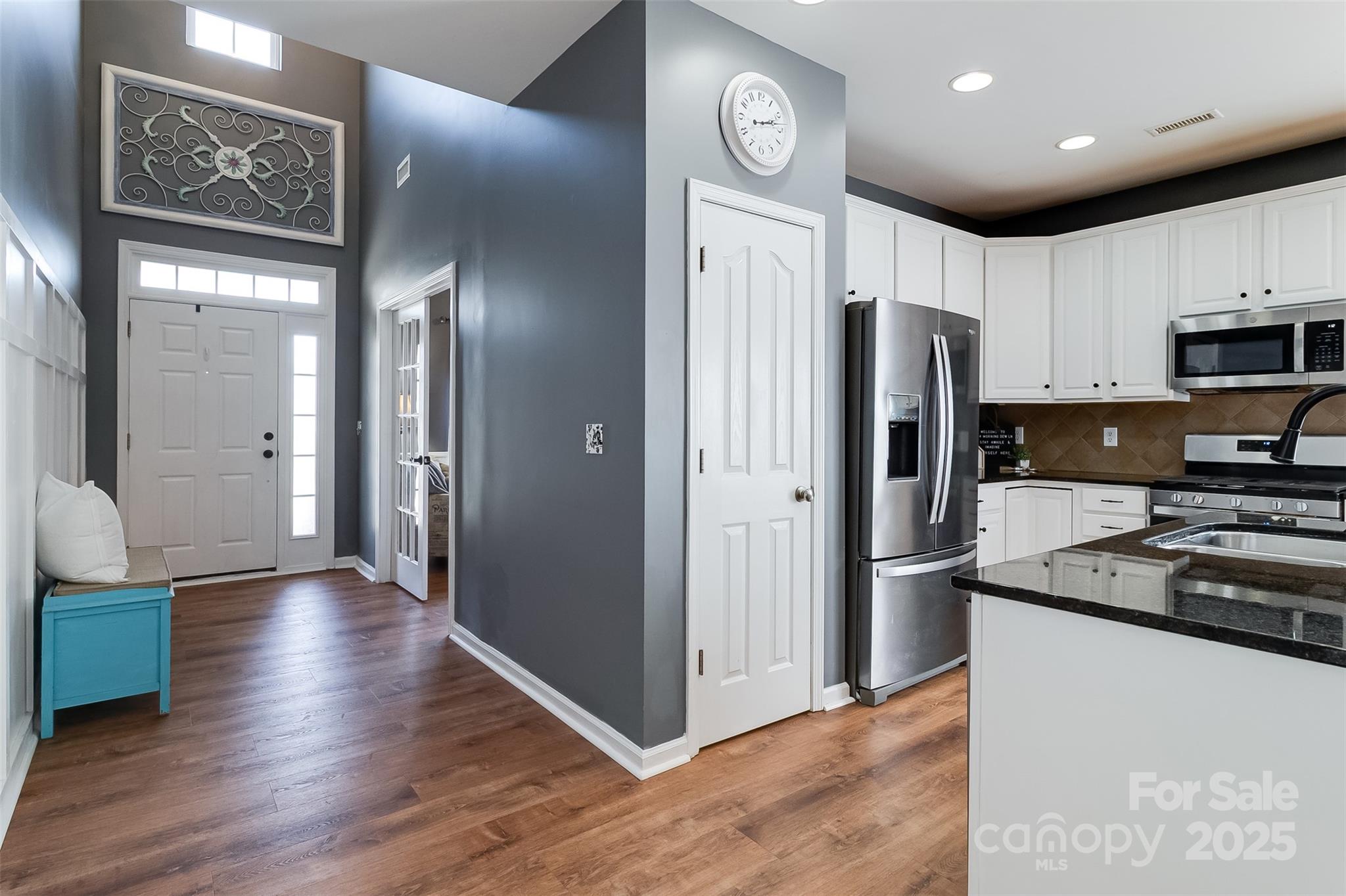 224 Morning Dew Lane Mount Holly, NC 28120 - Photo 7 of 48 a kitchen with stainless steel appliances granite countertop a refrigerator and a stove