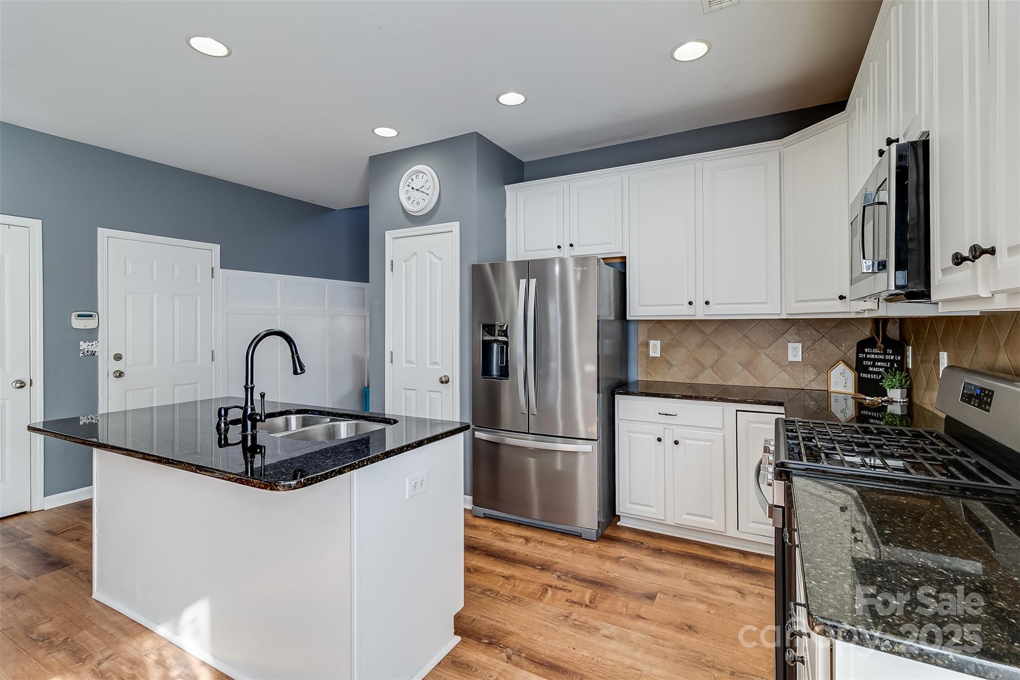 224 Morning Dew Lane Mount Holly, NC 28120 - Photo 10 of 48 a kitchen with stainless steel appliances granite countertop a sink stove and refrigerator