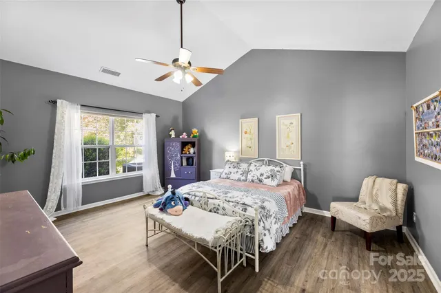 a bedroom with a bed and a couch