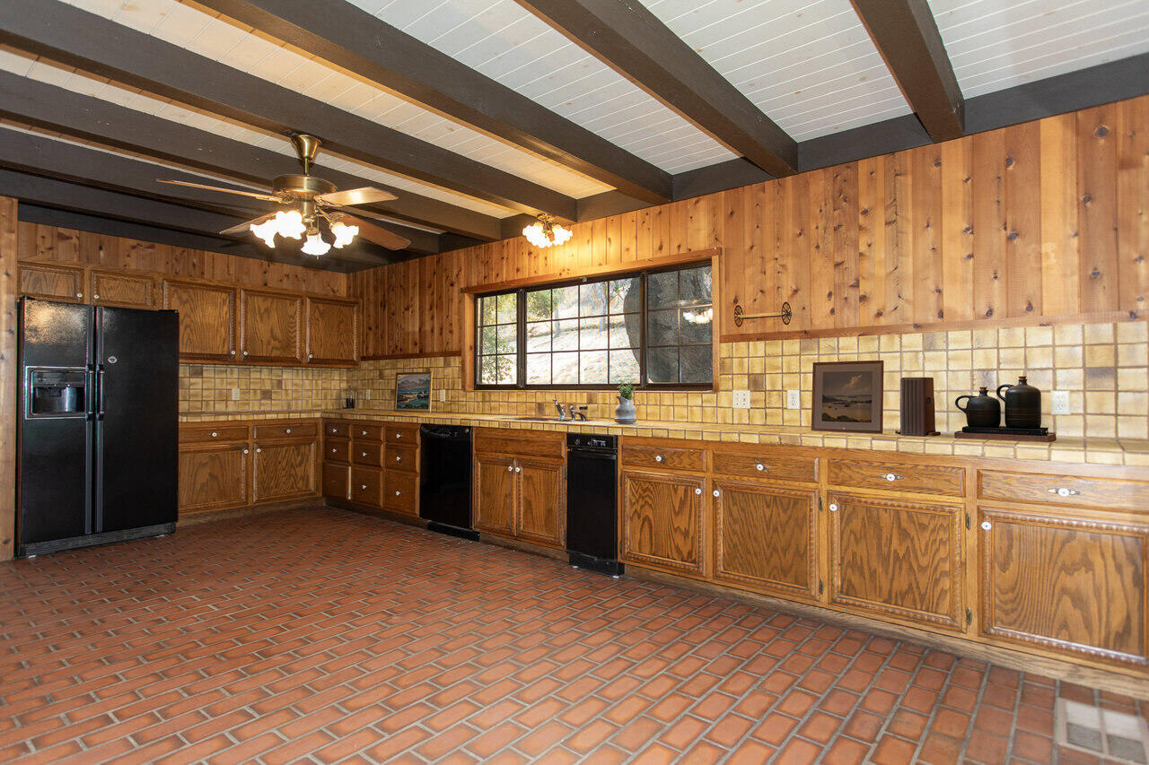 4260 Oak View Road Santa Ynez, CA 93460 - Photo 11 of 98 a kitchen with cabinets a sink and stainless steel appliances