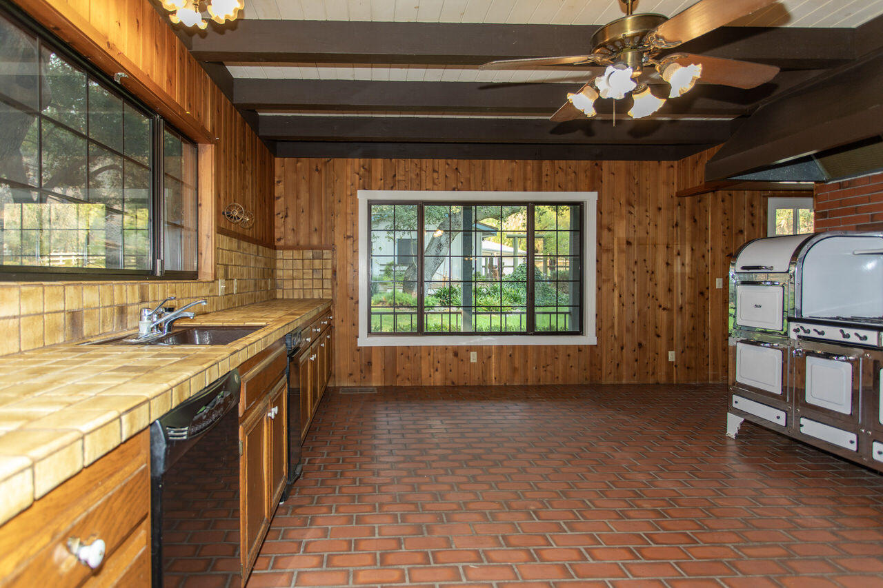 4260 Oak View Road Santa Ynez, CA 93460 - Photo 14 of 98 a kitchen with stainless steel appliances granite countertop a sink a stove cabinets and wooden floor