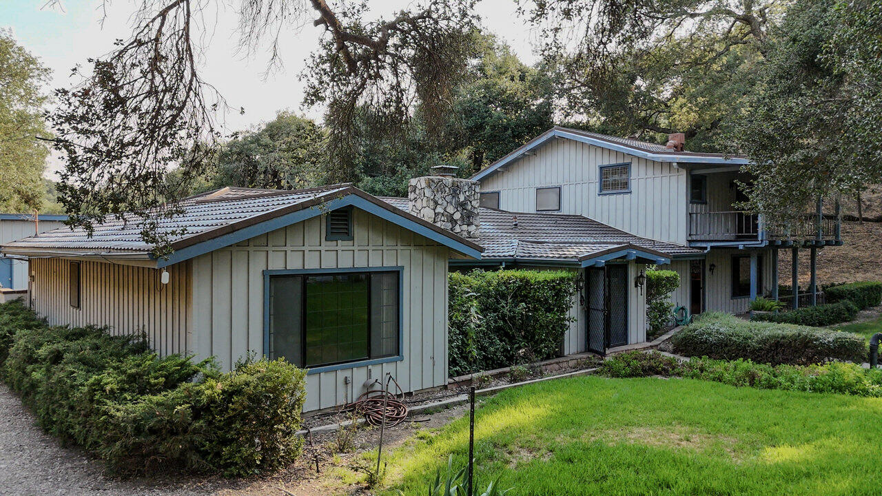 4260 Oak View Road Santa Ynez, CA 93460 - Photo 2 of 98 a front view of a house with garden