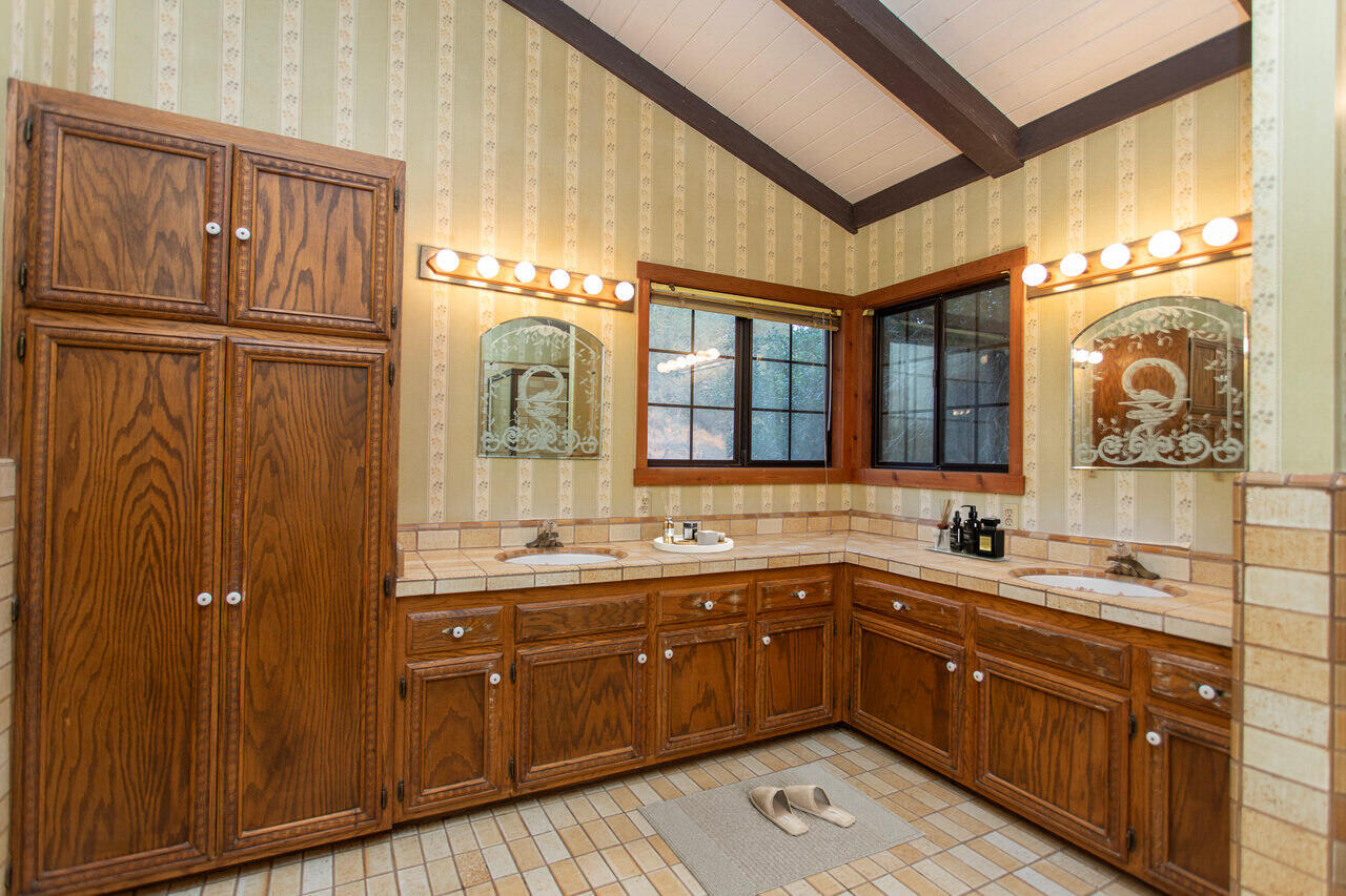 4260 Oak View Road Santa Ynez, CA 93460 - Photo 30 of 98 a spacious bathroom with a sink and a mirror