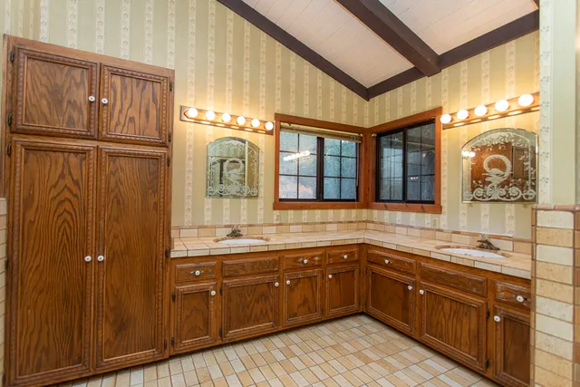 a front view of house with a garden