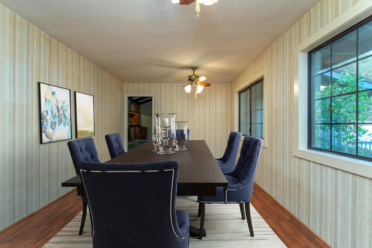 4260 Oak View Road Santa Ynez, CA 93460 - Photo 33 of 98 a view of a dining room with furniture and wooden floor