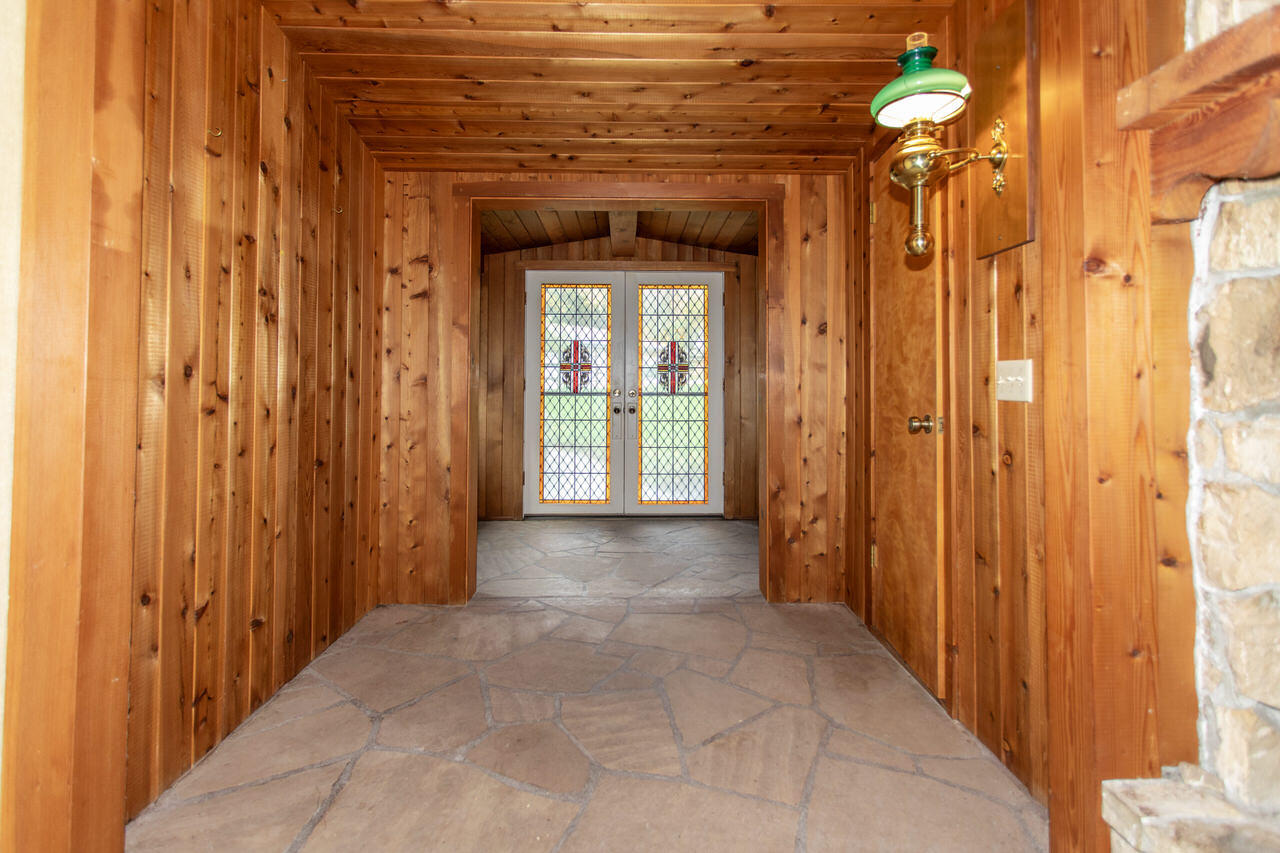 4260 Oak View Road Santa Ynez, CA 93460 - Photo 35 of 98 a view of a hallway with wooden shelves