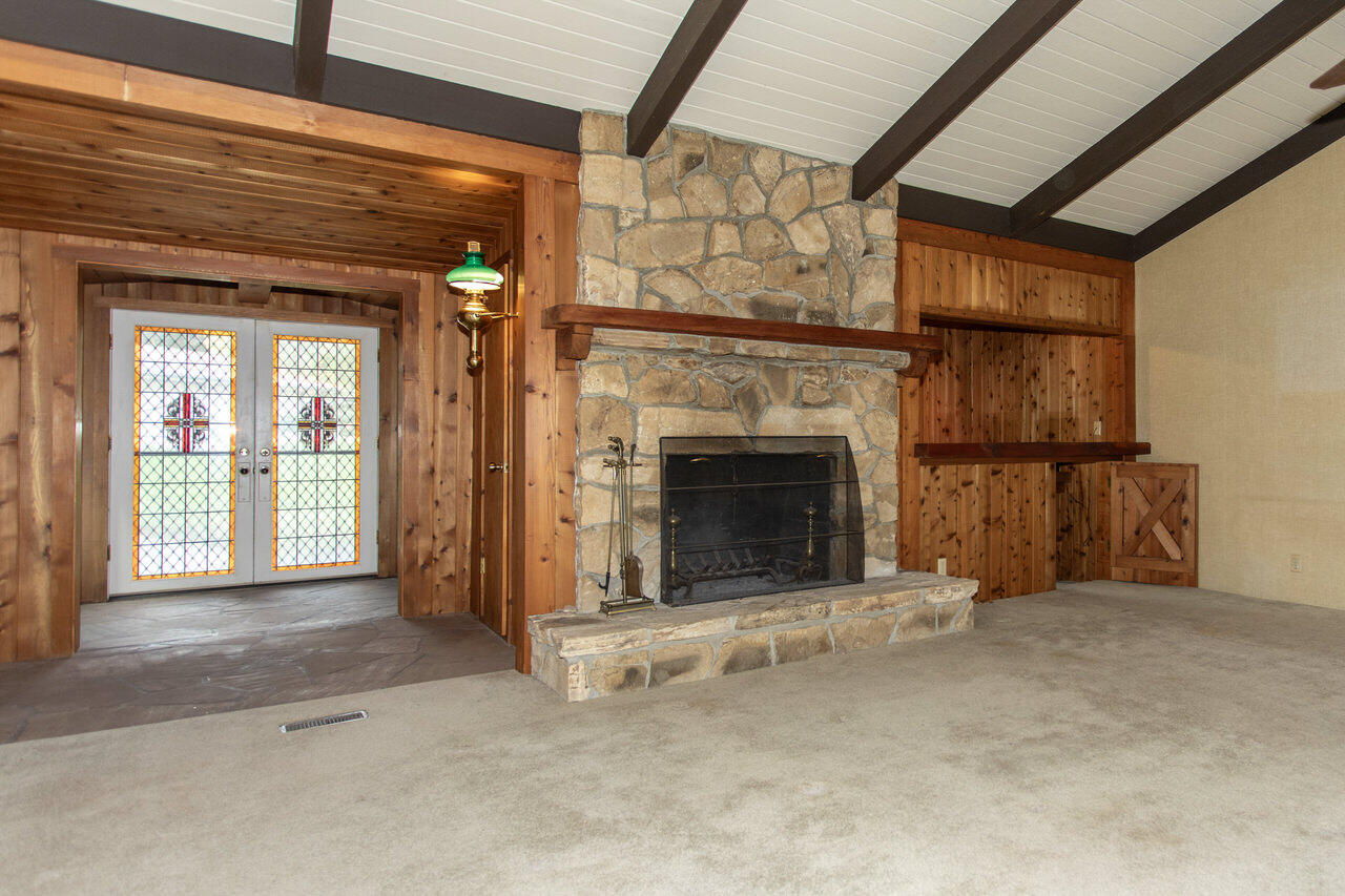 4260 Oak View Road Santa Ynez, CA 93460 - Photo 36 of 98 a view of an empty room with fireplace and a window