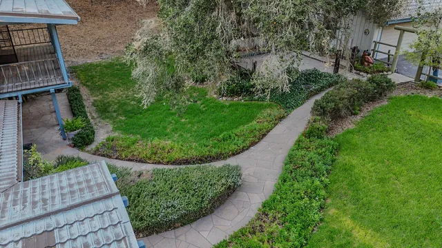 a view of house with a garden