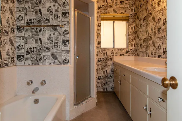 a living room with a couch and a chandelier