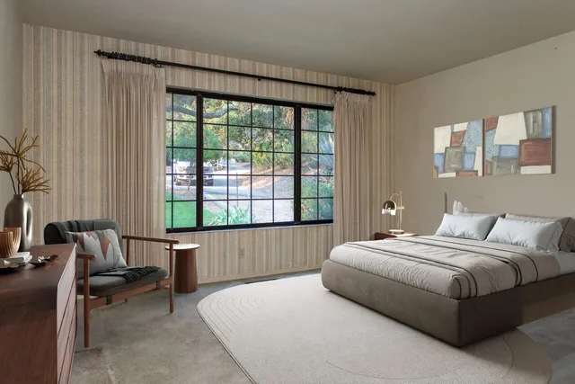 a view of a white house with a yard and large trees