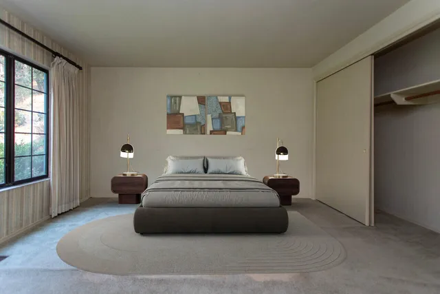 a kitchen with stainless steel appliances a refrigerator a sink and wooden floors