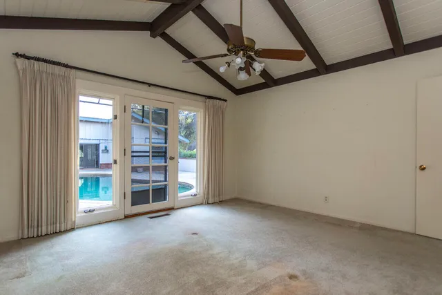 a picture of a bench in front of a wall