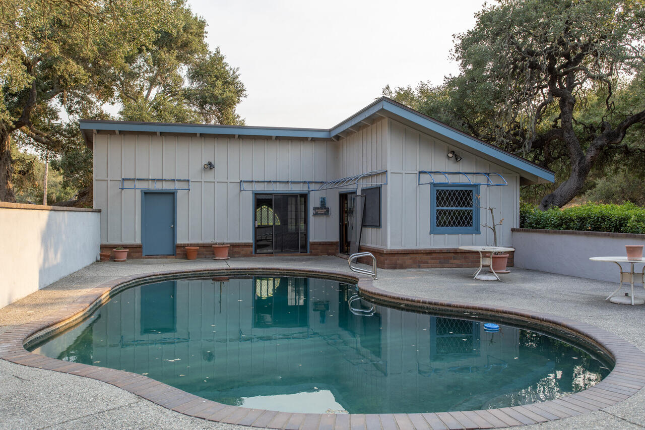 4260 Oak View Road Santa Ynez, CA 93460 - Photo 52 of 98 a view of a house with pool and chairs