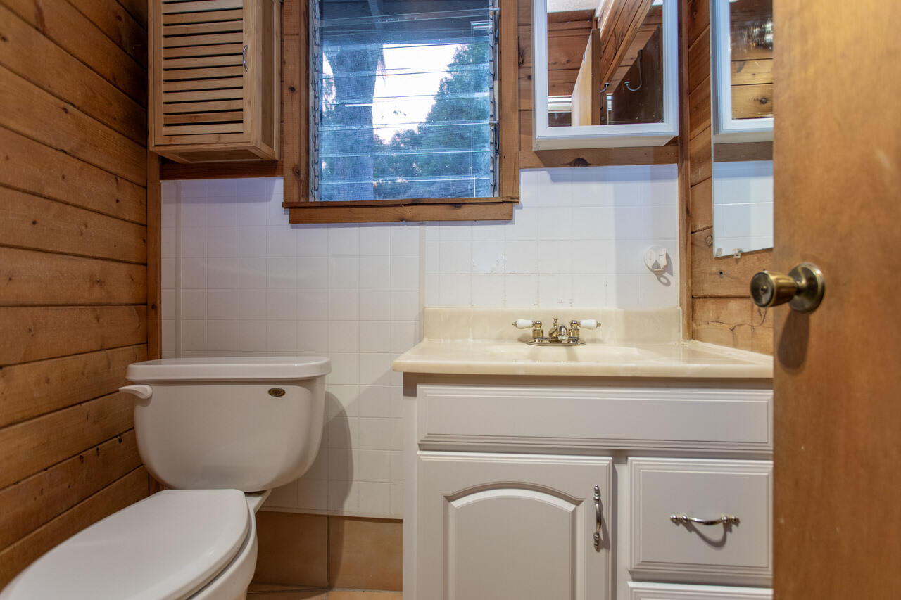 4260 Oak View Road Santa Ynez, CA 93460 - Photo 79 of 98 a bathroom with a toilet a sink and a mirror
