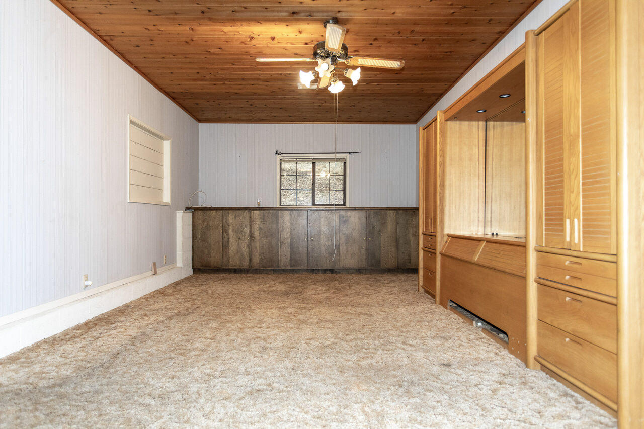 4260 Oak View Road Santa Ynez, CA 93460 - Photo 84 of 98 an empty room with chandelier fan and windows