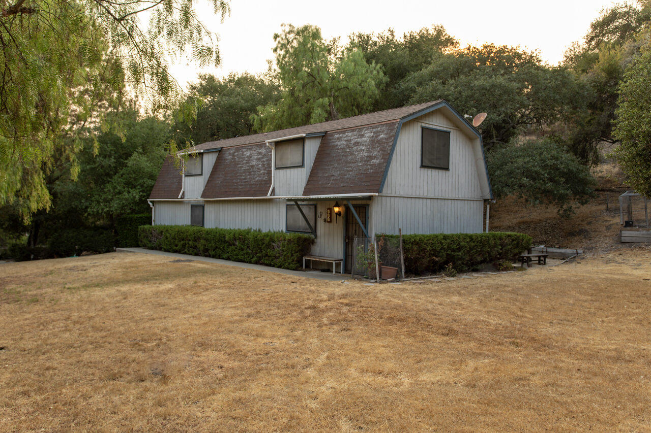 4260 Oak View Road Santa Ynez, CA 93460 - Photo 85 of 98 a view of a white house with a yard and large trees