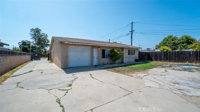 a view of a backyard with potted plants