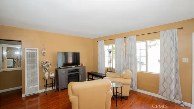 a kitchen with stainless steel appliances granite countertop a refrigerator and a stove