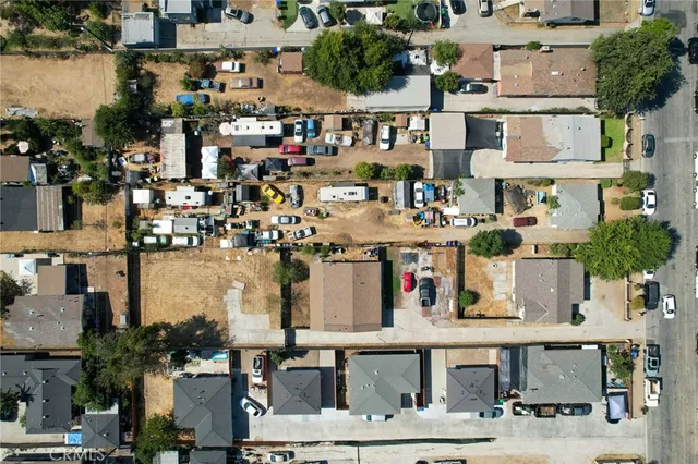 an aerial view of residential houses with city view