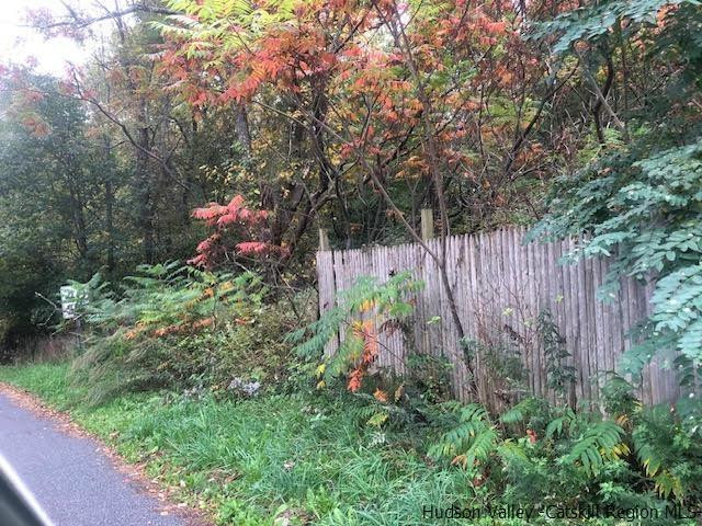 673 Alcove Road New Baltimore, NY 12087 - Photo 10 of 11 a backyard of a house with lots of green space and a fountain