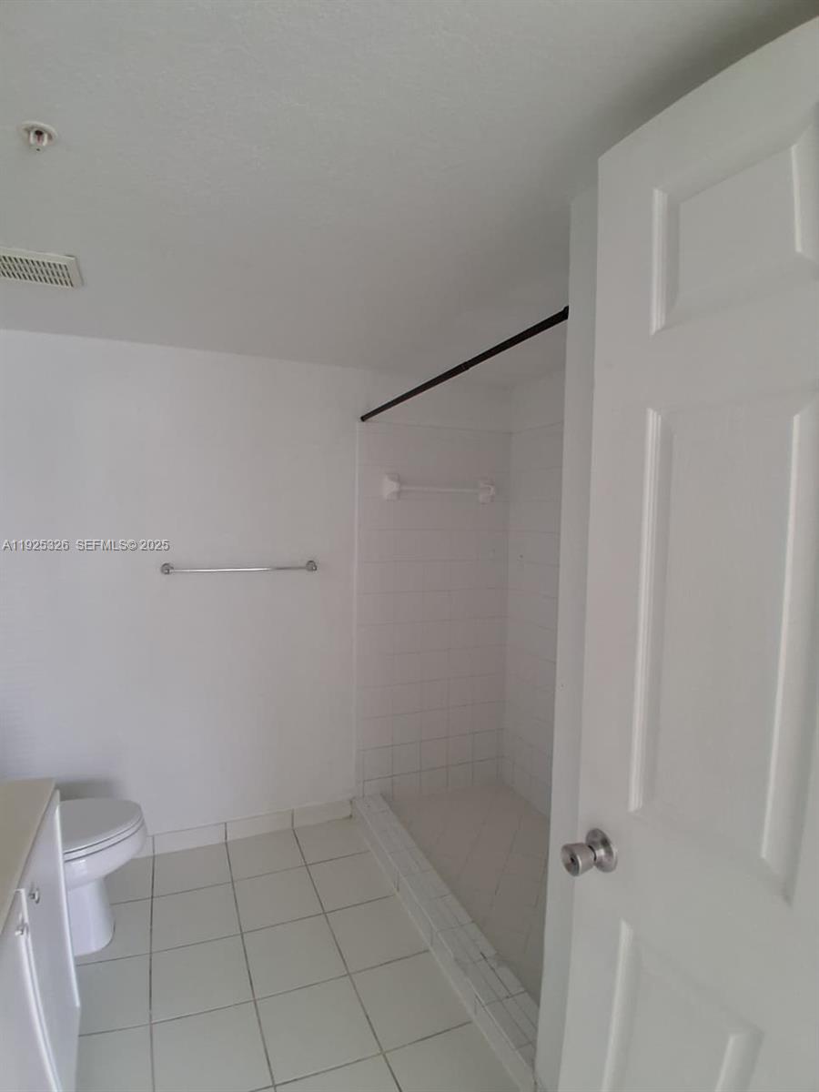 15460 Southwest 284th Street, Unit 4307 Homestead, FL 33033 - Photo 12 of 13 a bathroom with a shower
