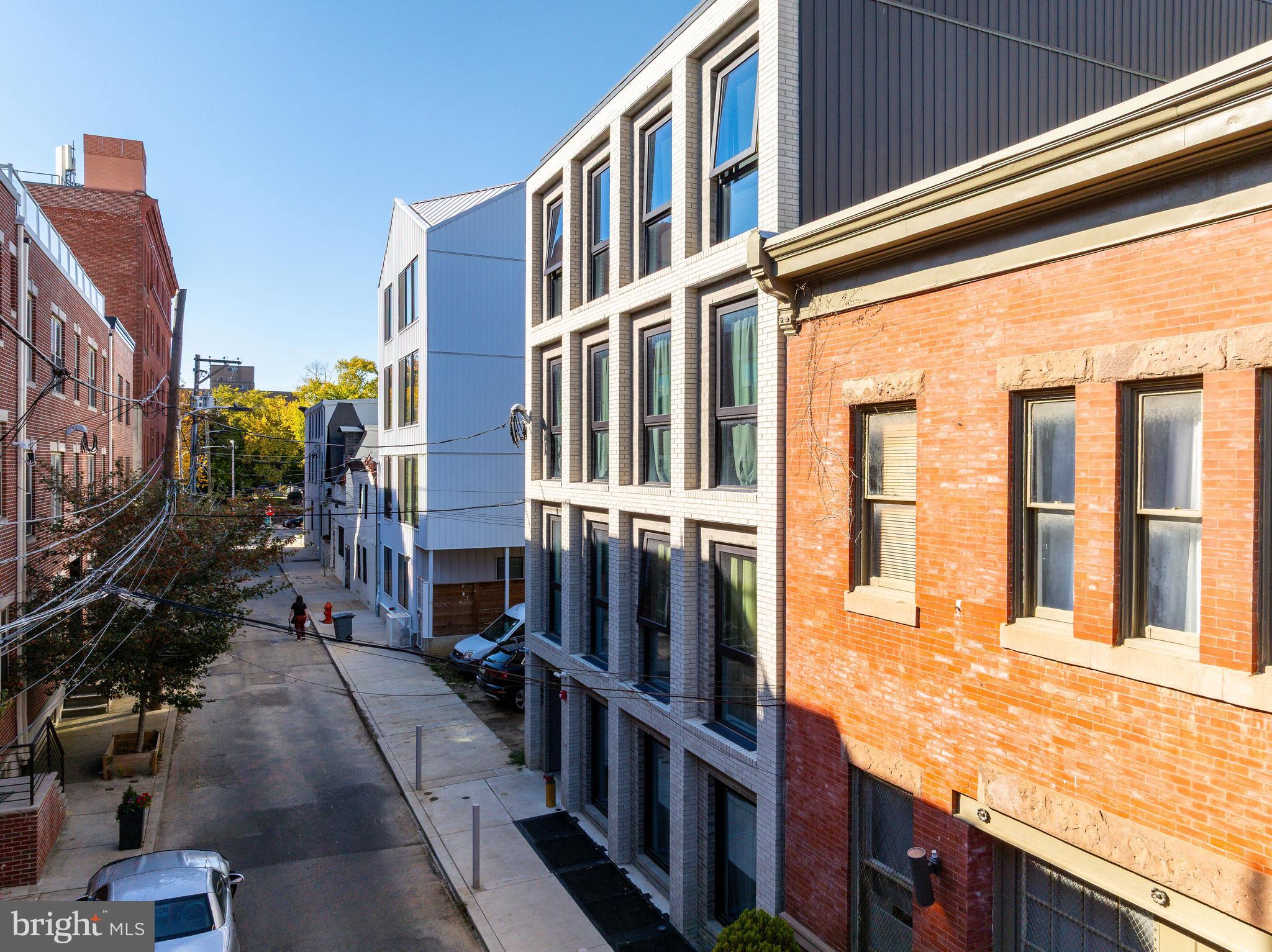 2007 Cambridge Street Philadelphia, PA 19130 - Photo 11 of 33 a view of a building with many windows