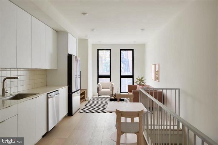 2007 Cambridge Street Philadelphia, PA 19130 - Photo 15 of 33 a kitchen with sink cabinets and appliances