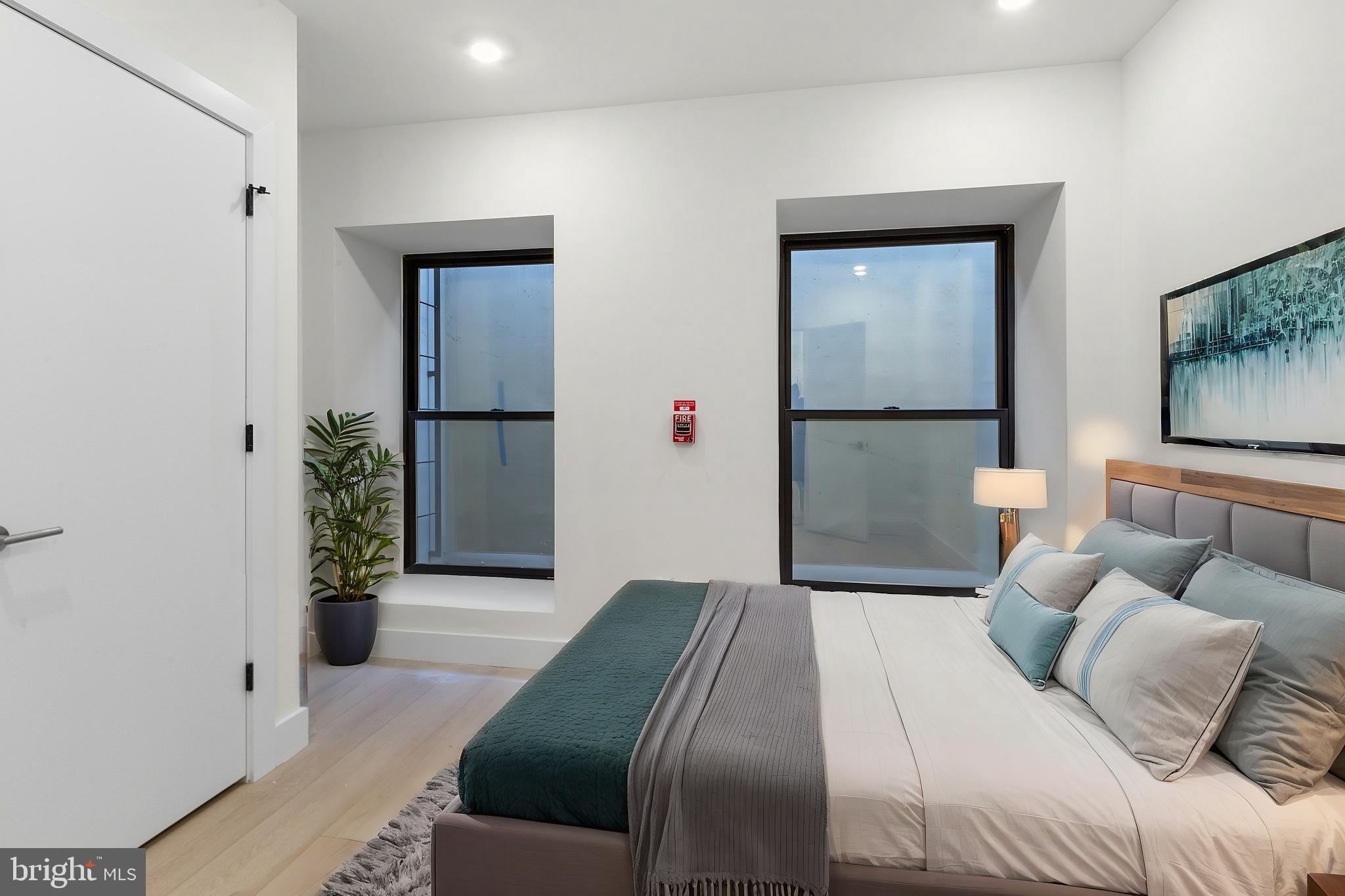 2007 Cambridge Street Philadelphia, PA 19130 - Photo 22 of 33 a bedroom with a bed and a couch