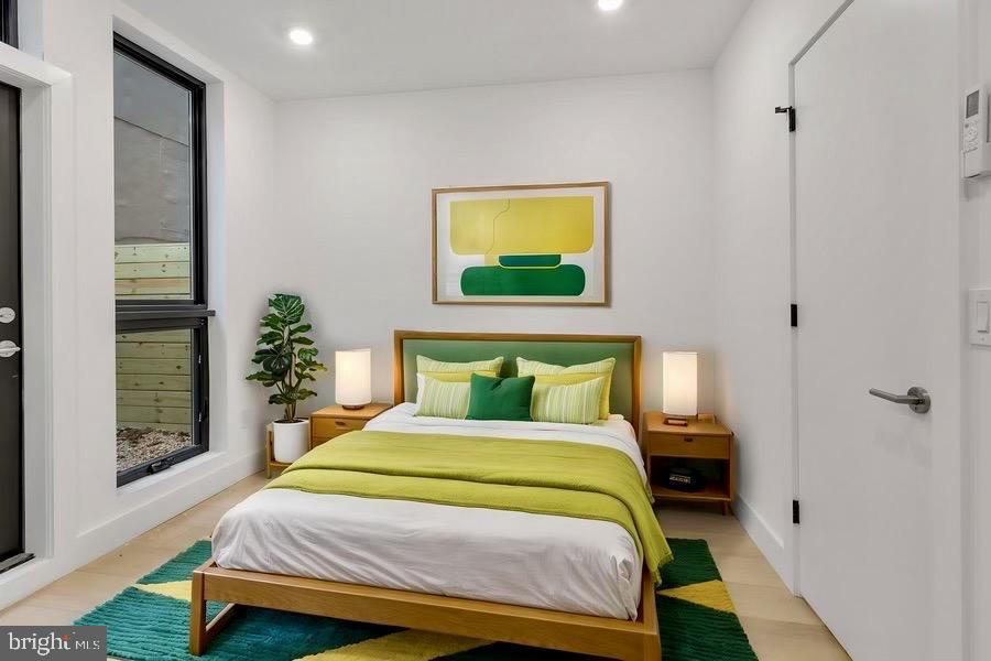 2007 Cambridge Street Philadelphia, PA 19130 - Photo 23 of 33 a bedroom with a bed and a painting on the wall