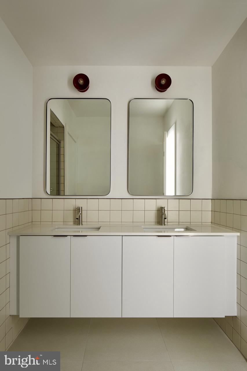 2007 Cambridge Street Philadelphia, PA 19130 - Photo 24 of 33 a bathroom with a sink and a mirror