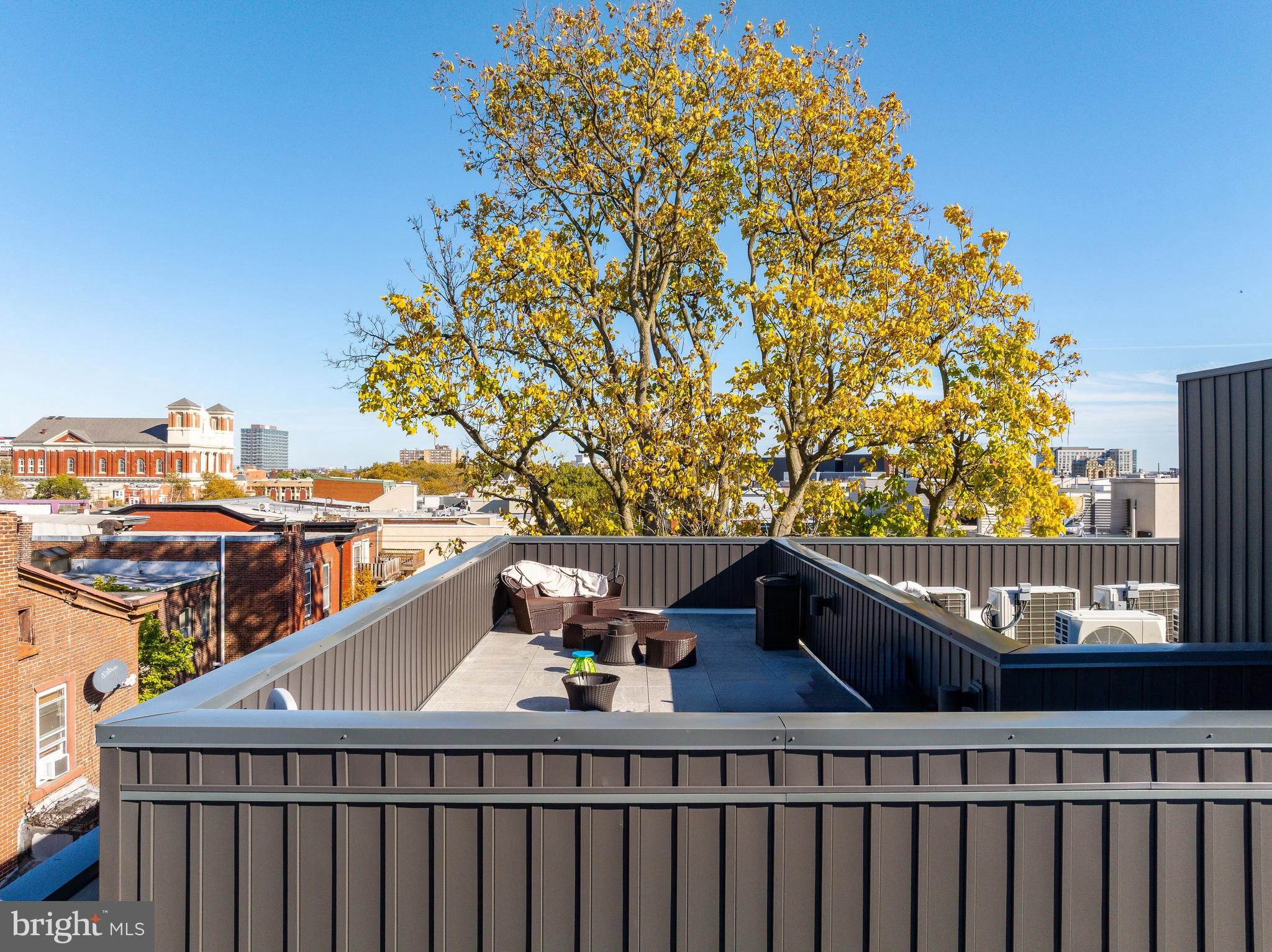 2007 Cambridge Street Philadelphia, PA 19130 - Photo 32 of 33 a view of a balcony with wooden floor and fence