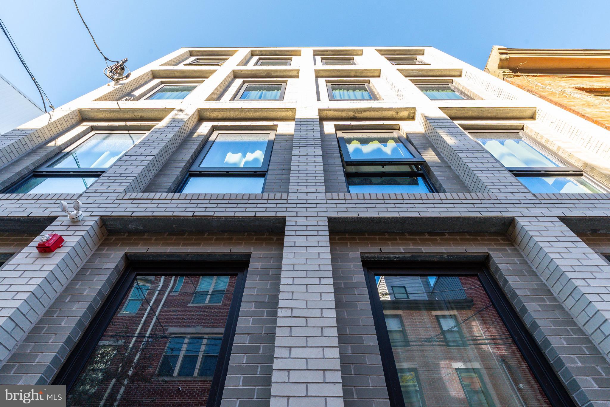 2007 Cambridge Street Philadelphia, PA 19130 - Photo 5 of 33 a building with multiple windows