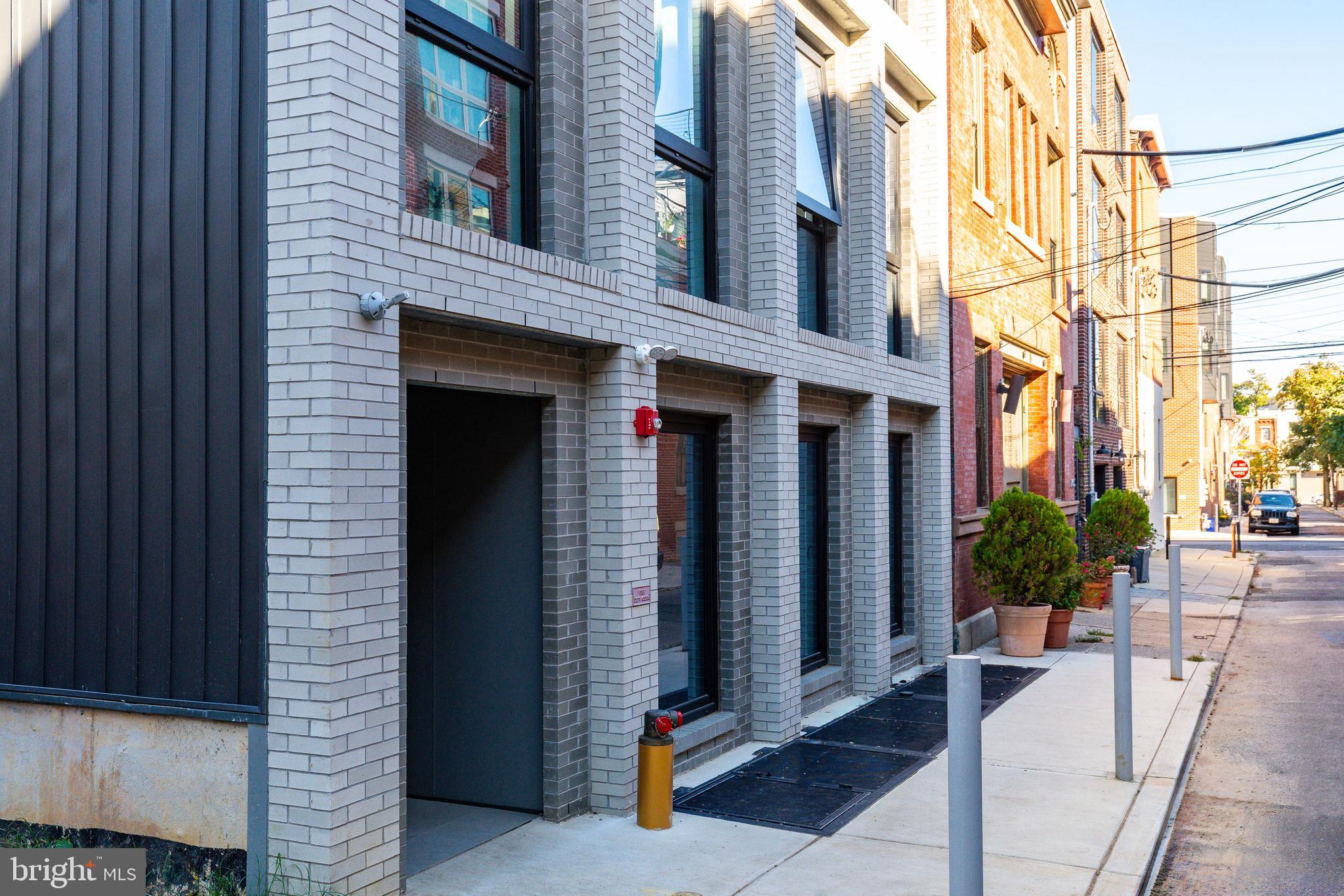 2007 Cambridge Street Philadelphia, PA 19130 - Photo 7 of 33 a view of a brick house with plants