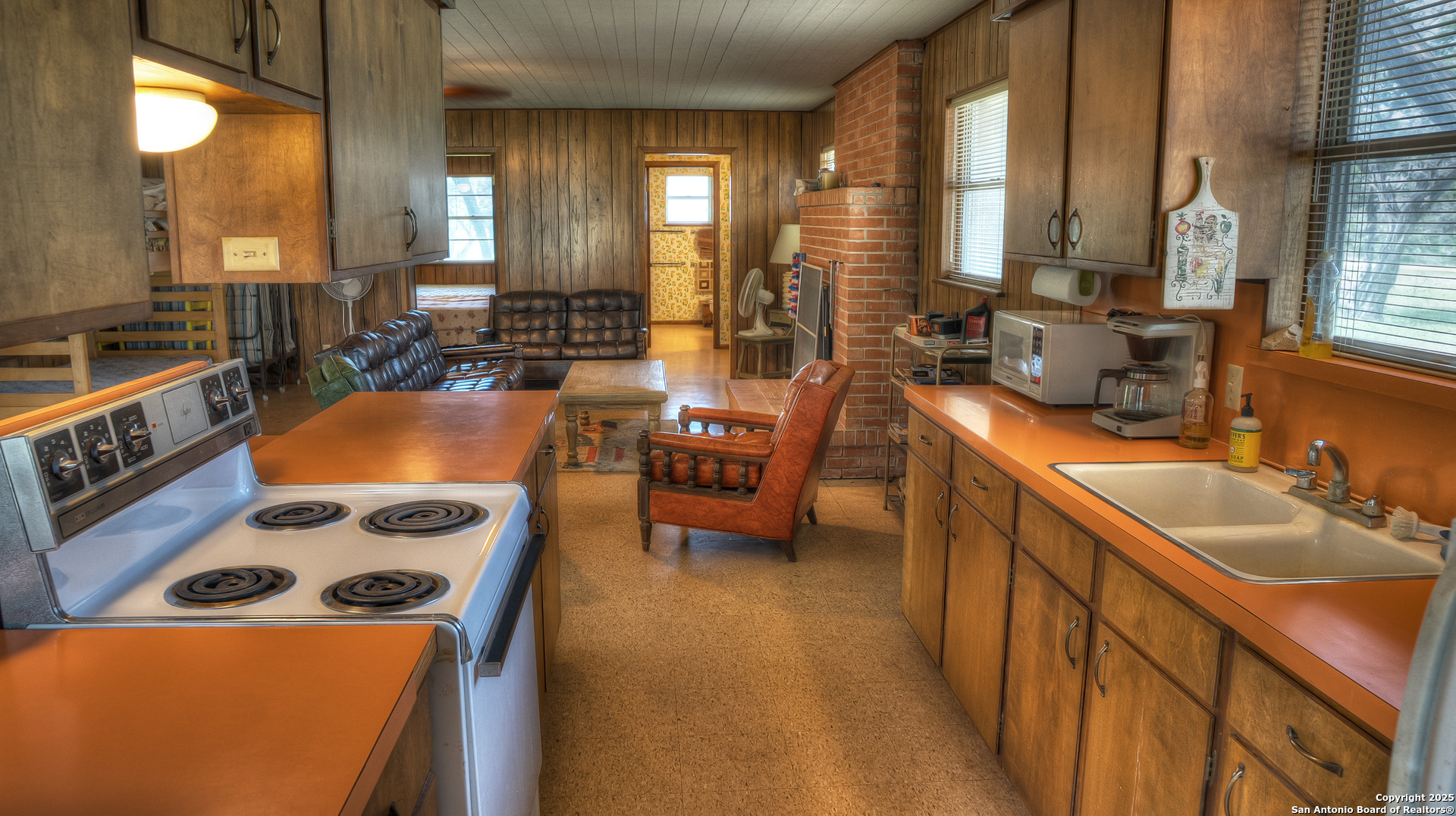 154 Weston Road Leakey, TX 78873 - Photo 32 of 39 a view of a kitchen a sink and living room