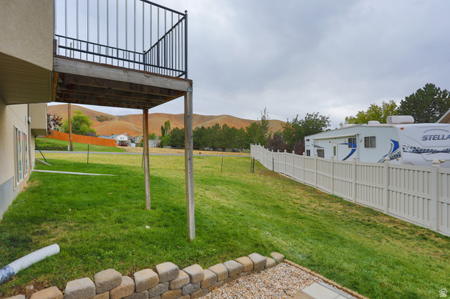 426 Deer Hollow Road Tooele, UT 84074 - Photo 35 of 37 View of yard with a mountain view