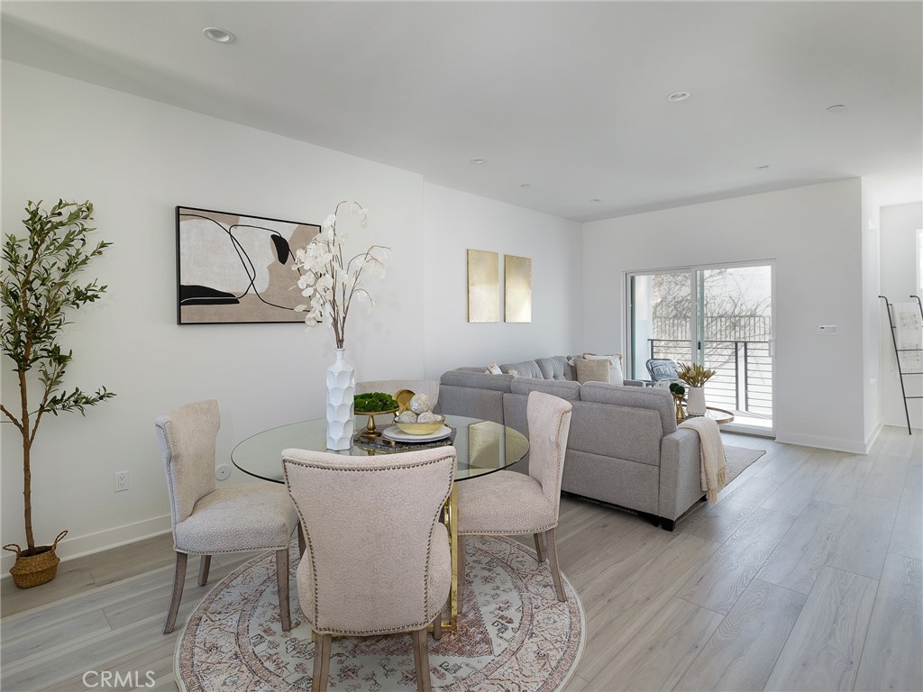 121 East 223rd Street, Unit 3 Carson, CA 90745 - Photo 11 of 34 a living room with furniture and a large window