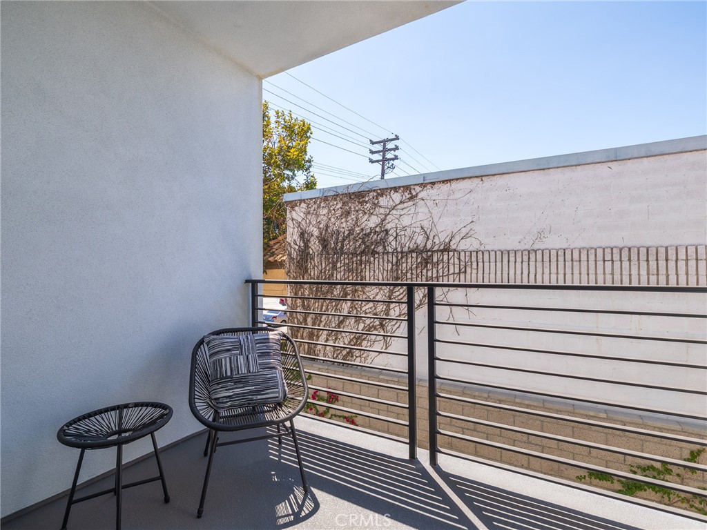 121 East 223rd Street, Unit 3 Carson, CA 90745 - Photo 13 of 34 a view of a balcony with wooden floor