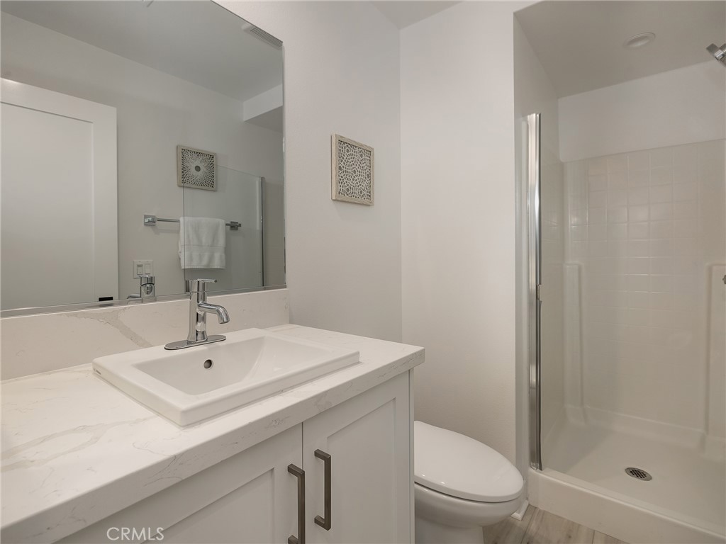 121 East 223rd Street, Unit 3 Carson, CA 90745 - Photo 14 of 34 a bathroom with a sink a toilet and shower