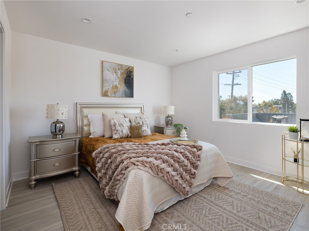 121 East 223rd Street, Unit 3 Carson, CA 90745 - Photo 15 of 34 a bedroom with a bed and a window