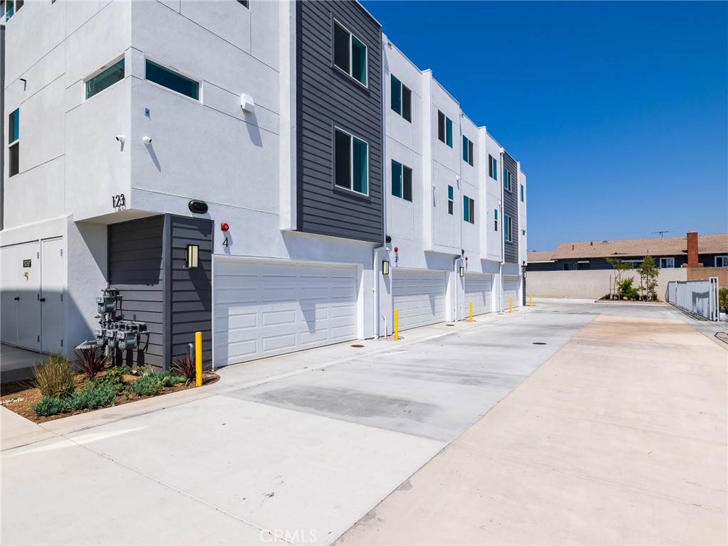 121 East 223rd Street, Unit 3 Carson, CA 90745 - Photo 28 of 34 a front view of a building with street