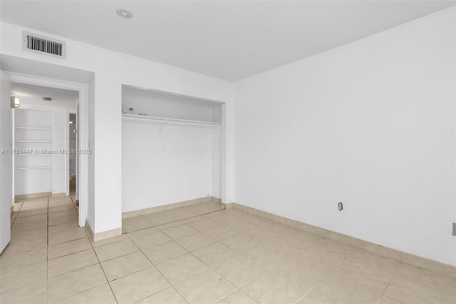 6884 North Kendall Drive, Unit C404 Pinecrest, FL 33156 - Photo 17 of 21 a view of an empty room