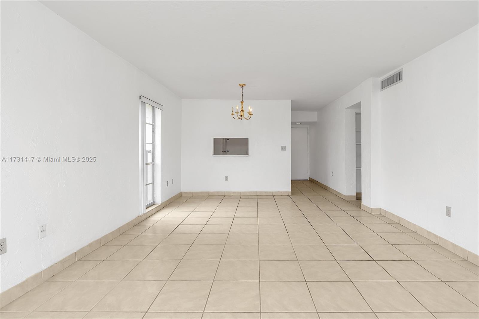 6884 North Kendall Drive, Unit C404 Pinecrest, FL 33156 - Photo 7 of 21 an empty room with windows